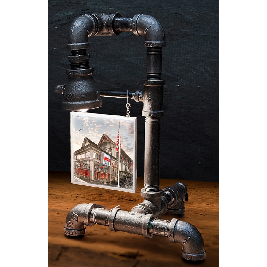 Industrial-style custom pipe lamp with black metal piping and a hanging tile image of a historic building, perfect for home decor
