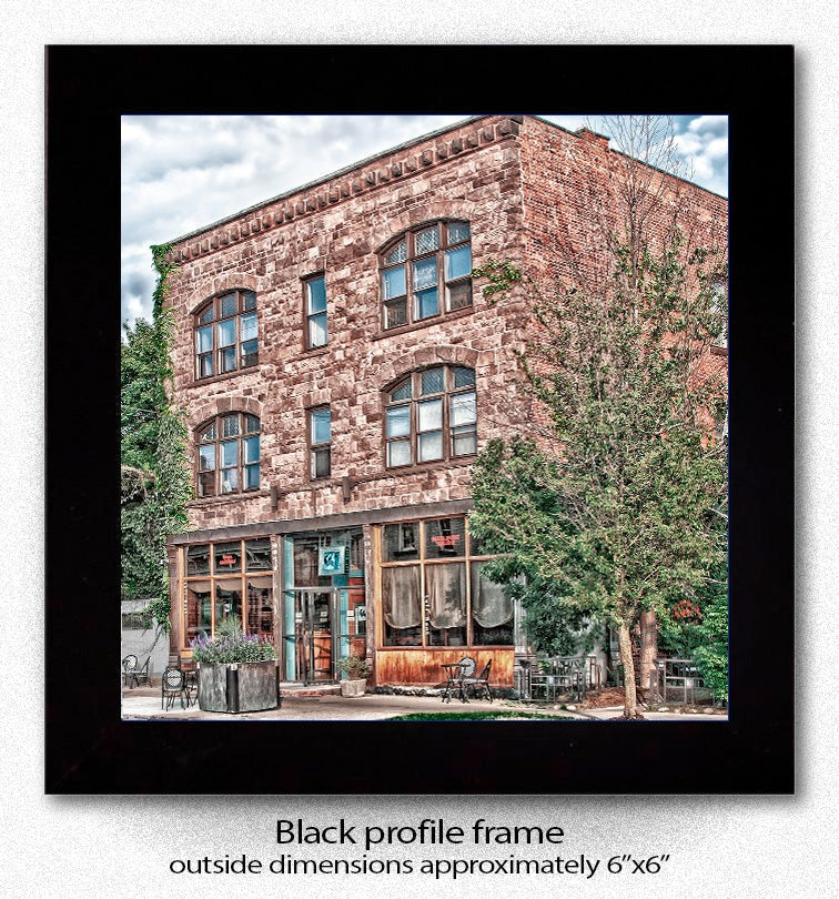 Framed Left Bank Ceramic Coaster with black profile frame, showcasing Buffalo landmark image, ideal for collectors and home decor.
