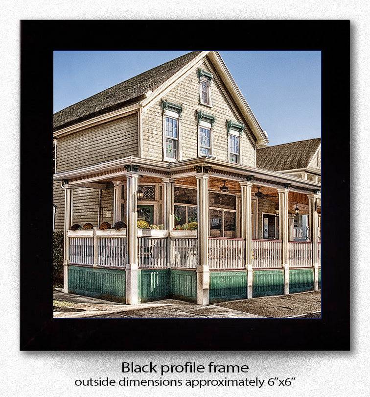 Framed ceramic coaster with The Place Restaurant image, black profile frame measuring approximately 6x6 inches for stylish home display.