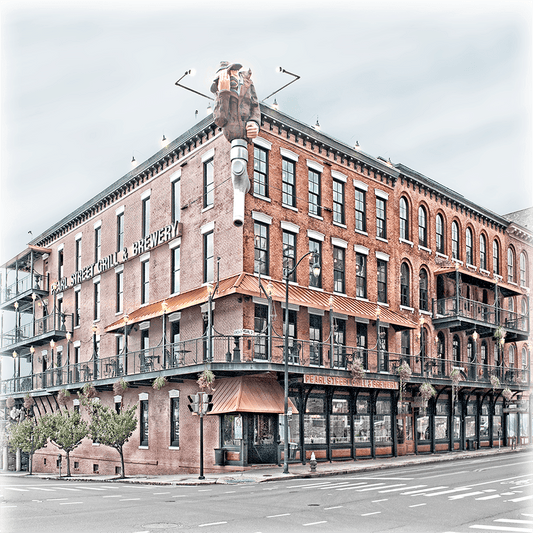 Close-up of Pearl Street Grill ceramic coaster showcasing Buffalo architecture, ideal for home decor or barware with a high-resolution photographic print.
