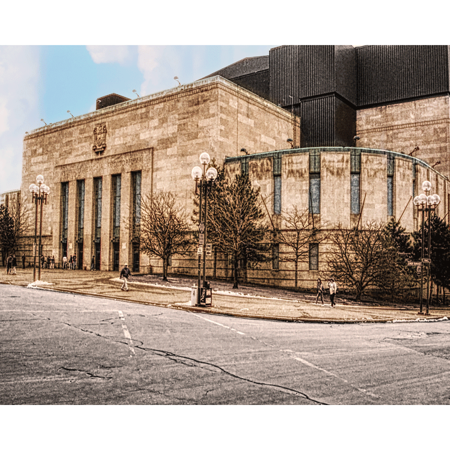 Memorial Auditorium photo - Buffalo historic sports venue shown in sepia tones with pedestrians and vintage architecture, ideal for decor.