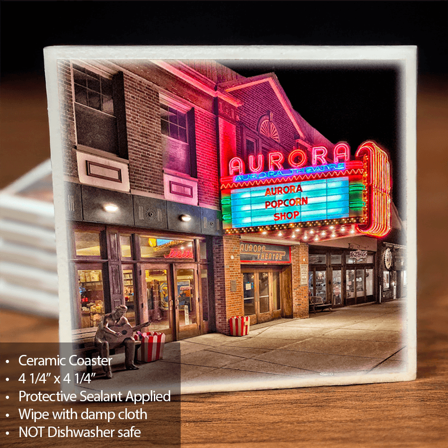 Aurora Theatre Coaster - Ceramic Keepsake featuring vibrant night photo of historic Aurora Theatre with neon lights, sealed and cork-backed for protection.