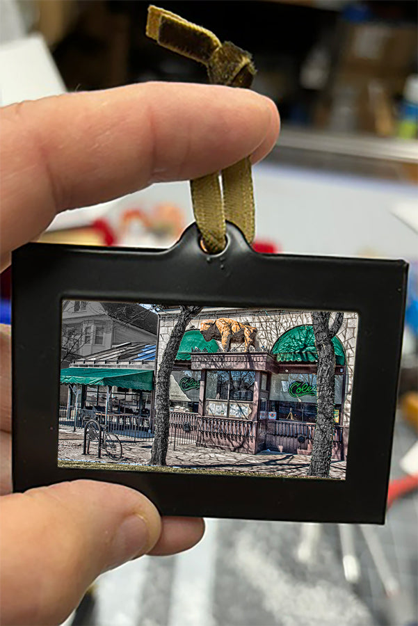 Mini Framed Artwork Ornament - Bill Dziejman's Art featuring a lively street café with bear sculptures, perfect for urban holiday decorations.
