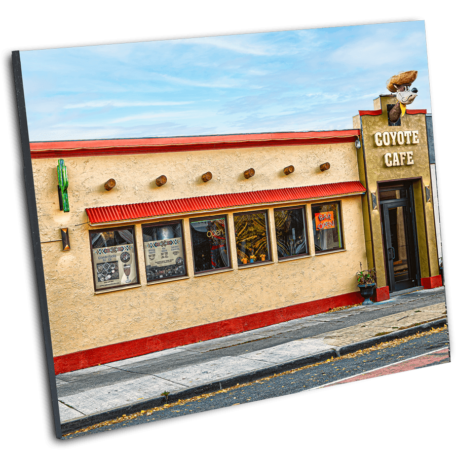 Coyote Cafe Buffalo Photography by Jman displayed in a tilted print format, showcasing vibrant architectural detail for visual artwork collectors.