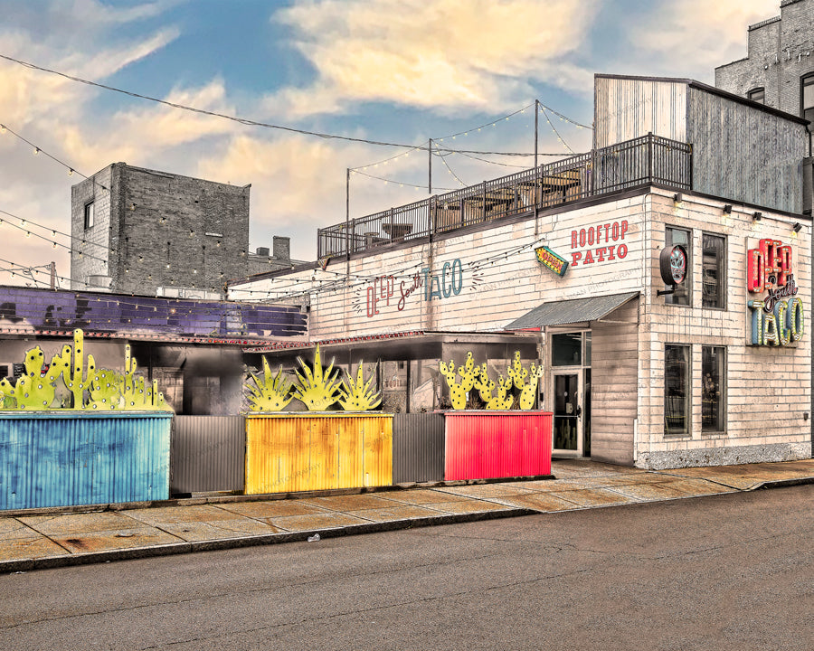 Deep South Taco prints - Buffalo Images featuring vibrant restaurant exterior with rooftop patio and colorful decor. Ideal wall art for food lovers.
