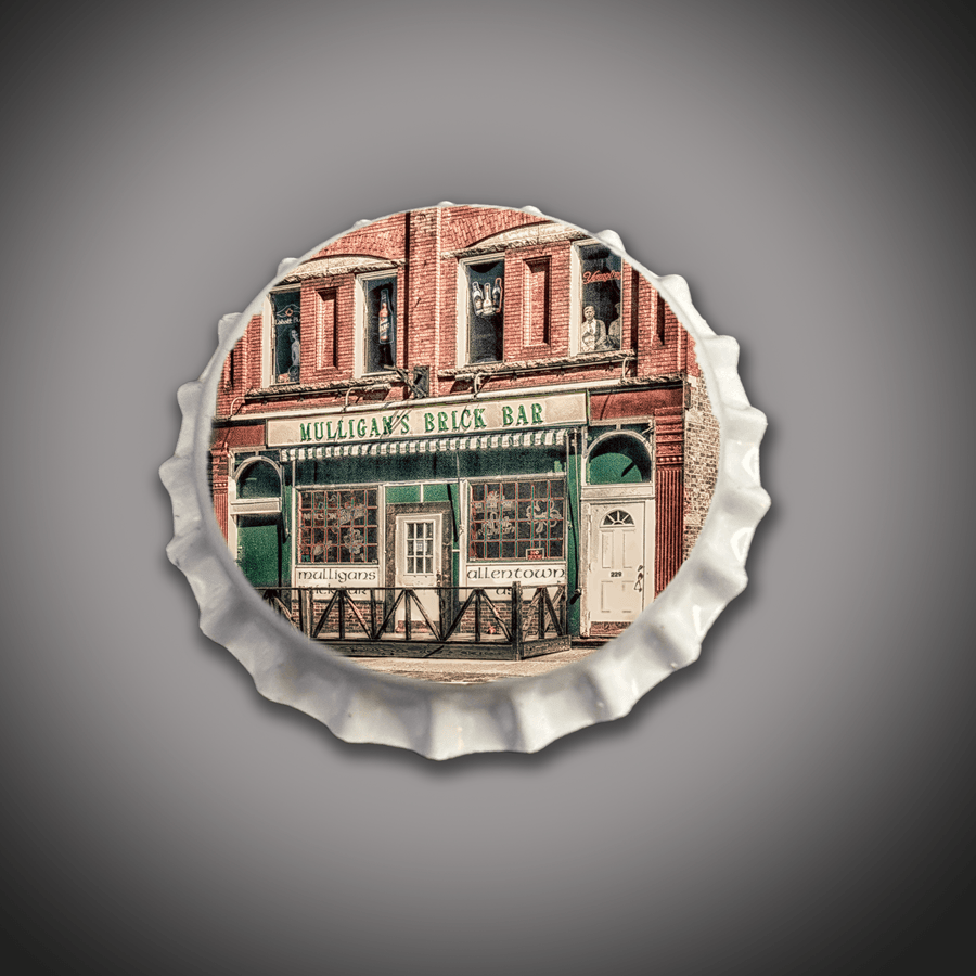 Brick Bar Stool - Mulligan's Bar Bottle Cap features a wooden black bar stool with a bottle cap seat design showcasing Mulligan's Brick Bar facade.