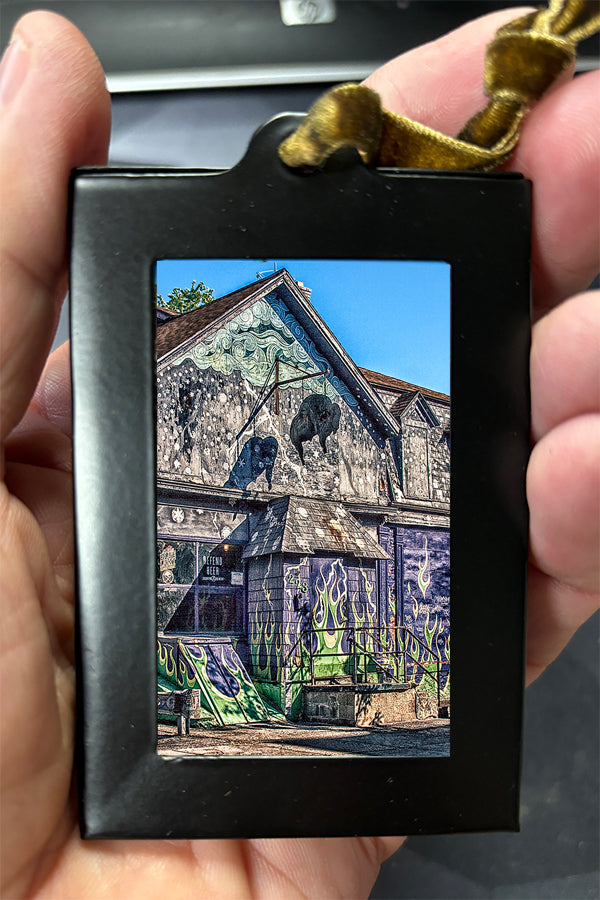 Mini Framed Artwork Ornament - Bill Dziejman's Art showing a graffiti-covered building with buffalo sculptures, ideal for urban art lovers.