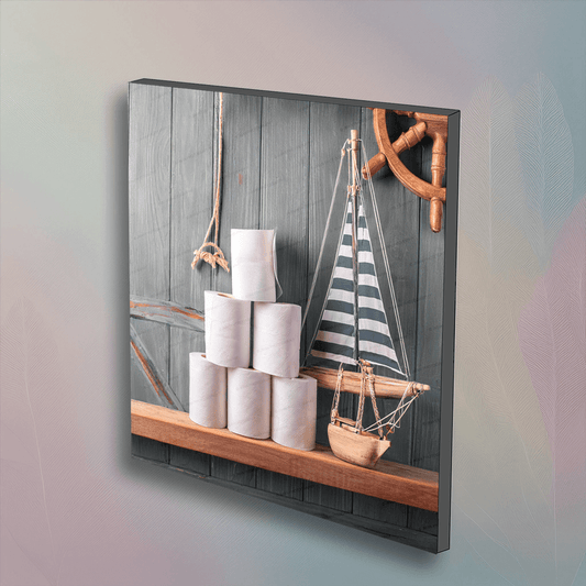 Sailboat Theme Roll of Toilet Paper Bathroom Wall Art featuring stacked toilet paper rolls beside a striped sailboat model and ship wheel decor.