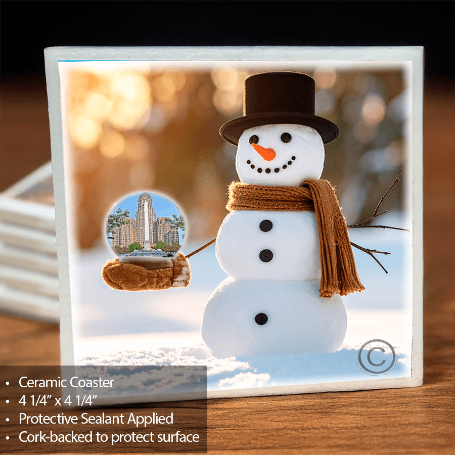 Snowman Globe Coaster Buffalo features a ceramic snowman holding a globe with Buffalo NY's City Hall & McKinley Monument. Cork-backed for surface protection.