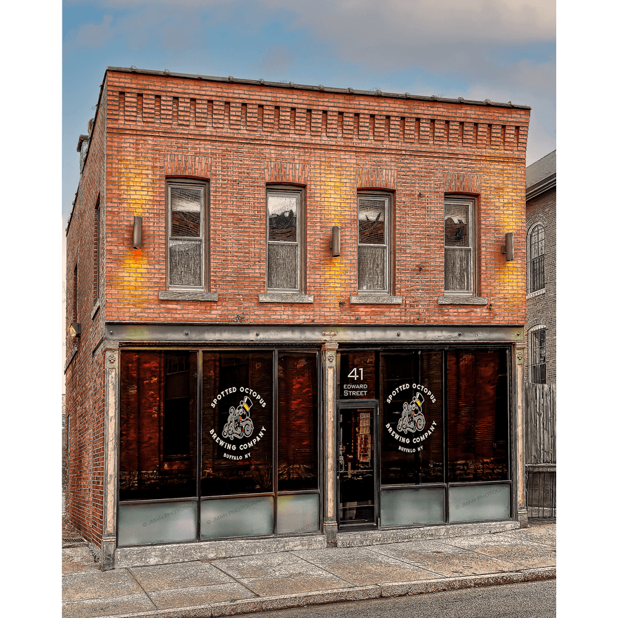 Spotted Octopus Brewing Photography - Taproom & Beer Visuals featuring the brick exterior of Spotted Octopus Brewing Co. in Buffalo, NY with logo windows and warm lighting. Ideal for home decor with Buffalo-WNY photo nostalgia.