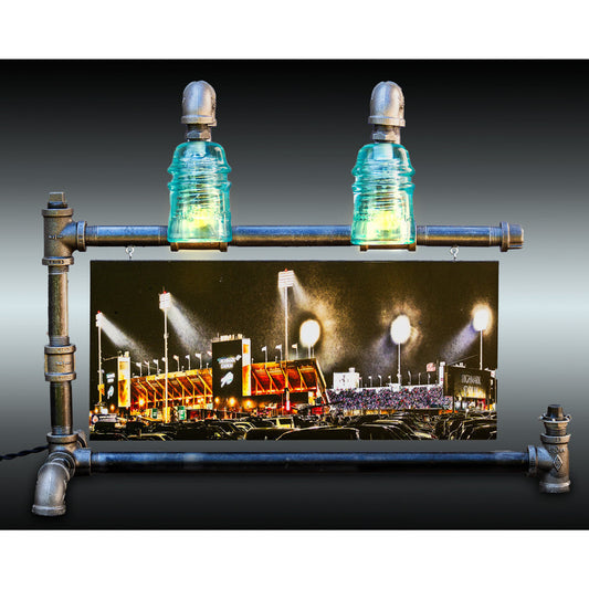 Buffalo Bills Stadium Steampunk Lamp with green glass insulators and industrial pipe frame, featuring a mounted night photo of Highmark Stadium.