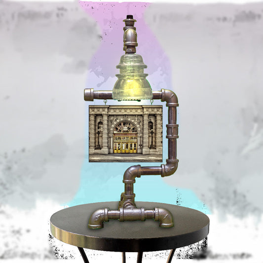 Ellicott Square Photo Steampunk Lamp with clear glass insulator and industrial pipe design, ideal Buffalo decor for home or office lighting.