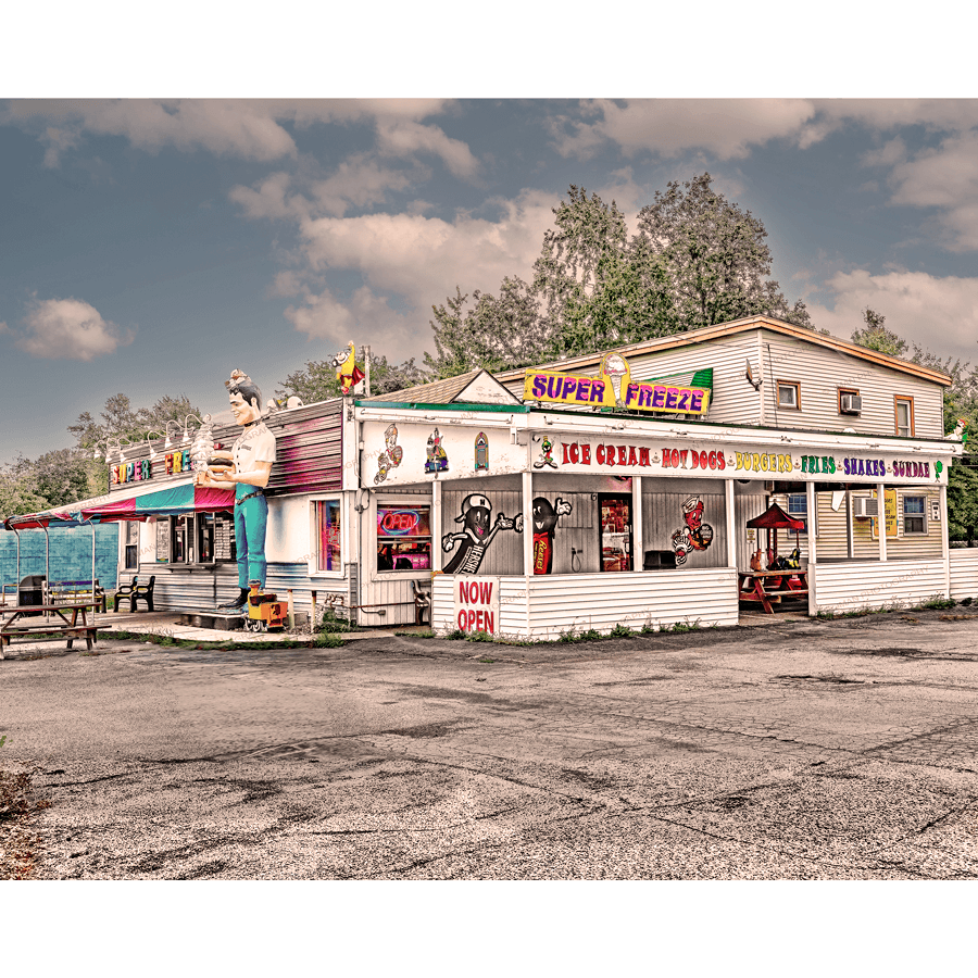 Super Freeze Ice Cream Diner - 1950s Art Print featuring a retro roadside stand with colorful signage, ideal for vintage kitchen or bar decor.