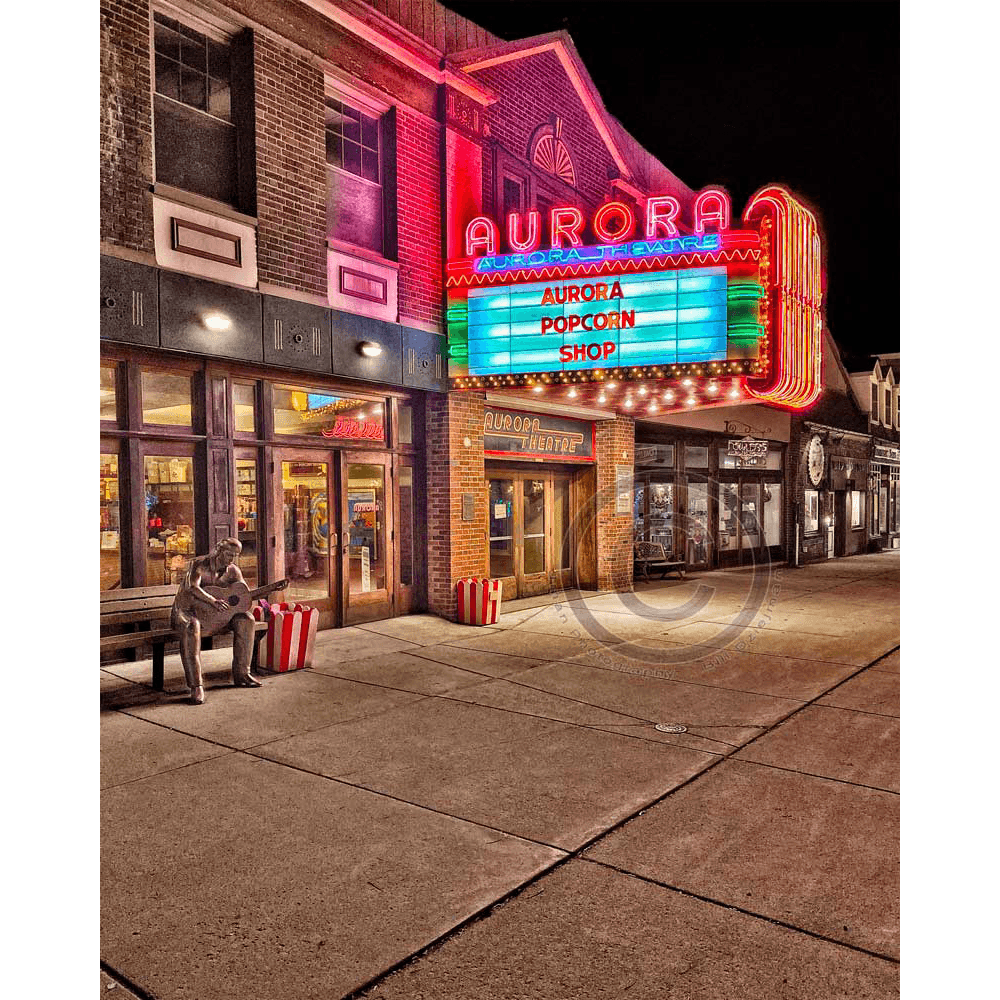 Aurora Theatre Magnet - East Aurora featuring vibrant neon lights and marquee at night. Ideal acrylic magnet for fridge or locker decor.