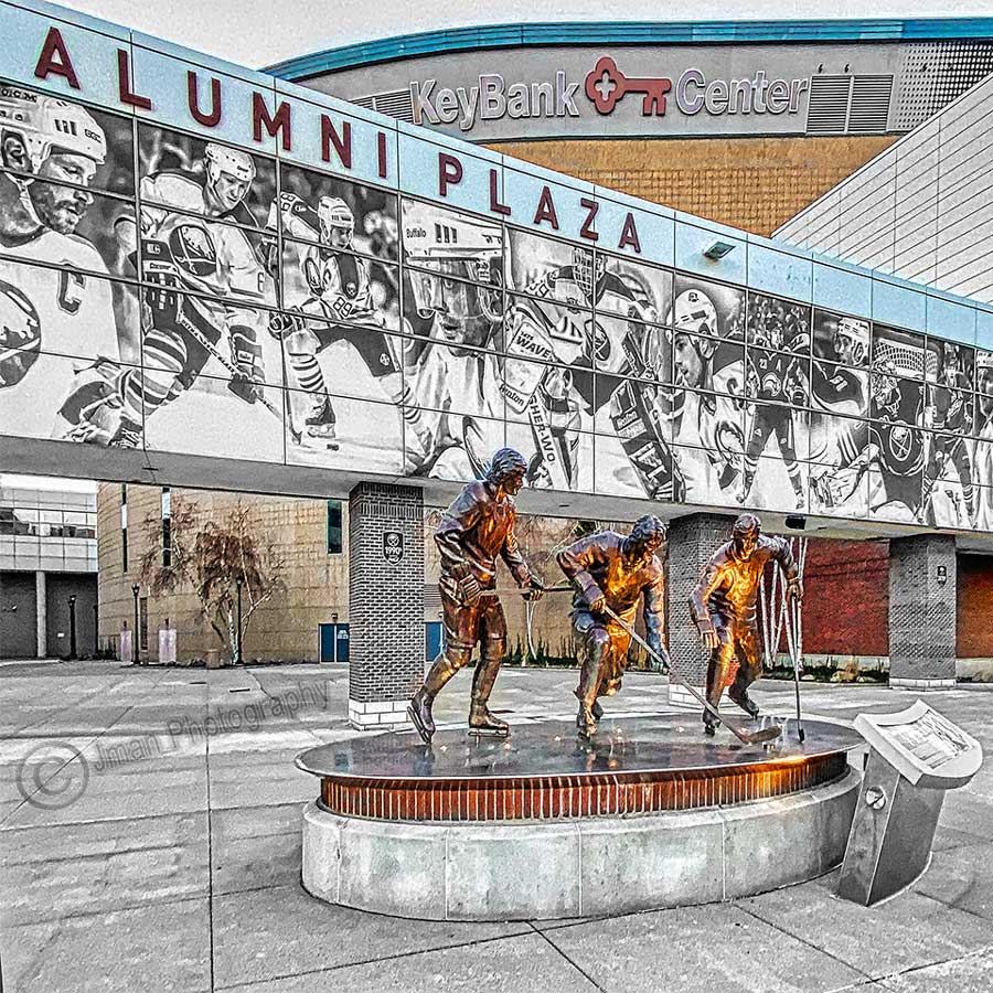 Photograph of Alumni Plaza at KeyBank Center in Buffalo, NY, with bronze statues of hockey players, featured on French Connection Ceramic Coaster.