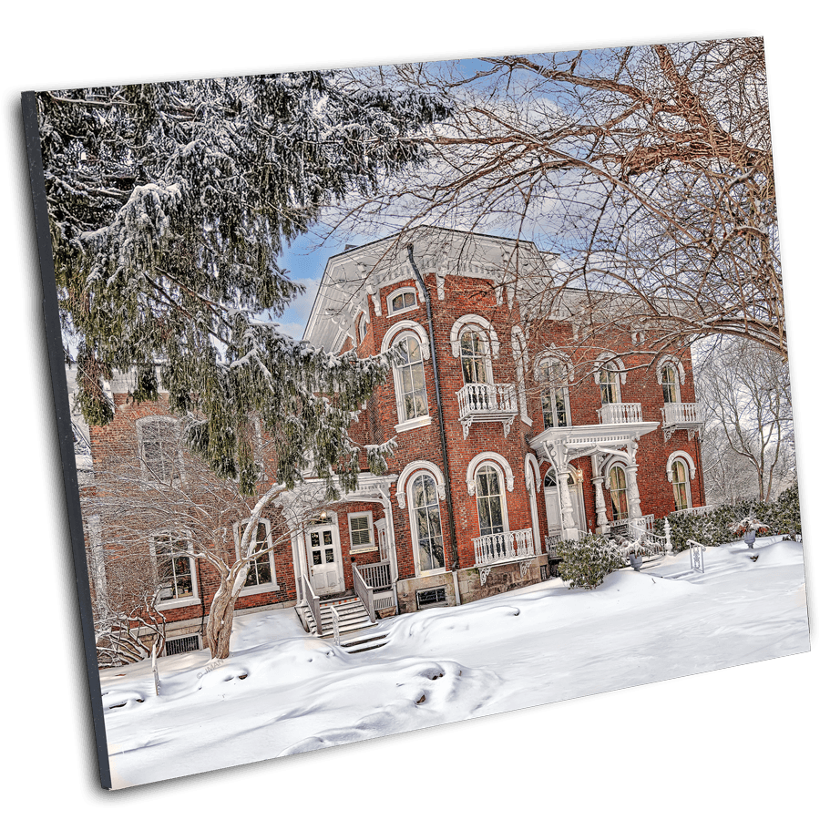 Kenan Center House Photo Print - Lockport NY Winter by Jman shows a red-brick Victorian mansion covered in snow, ideal for historical home decor.