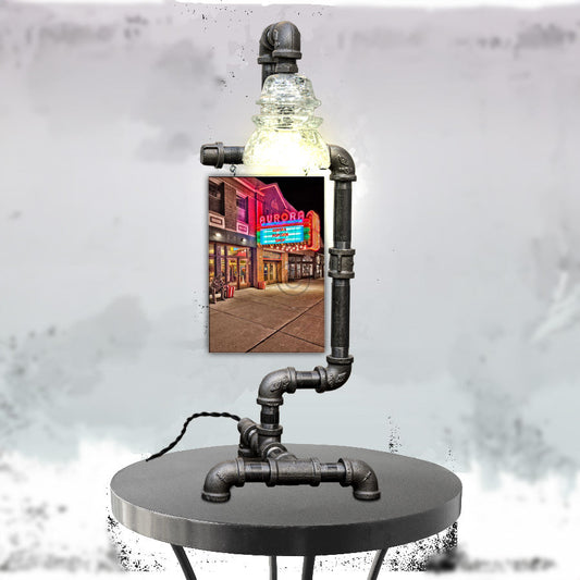 East Aurora Theatre Lamp with steampunk pipe design and clear insulator bulb, featuring a vivid photo of the historic East Aurora Theatre marquee.