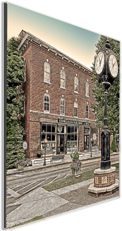 Angled view of Eshelman Building Prints - Clarence Center Photography, showcasing detailed vintage facade and iconic street clock artwork.