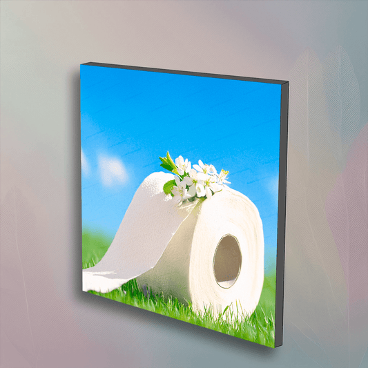White Flowers Art Toilet Paper wall art features a floral toilet paper roll on grass under a blue sky. Unique decor for modern bathroom design.
