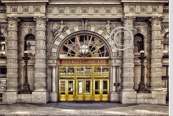 Ellicott Square Doors Magnet features a vivid photo of Buffalo's historic Ellicott Square Building entrance on durable acrylic. Ideal for home or office decor.