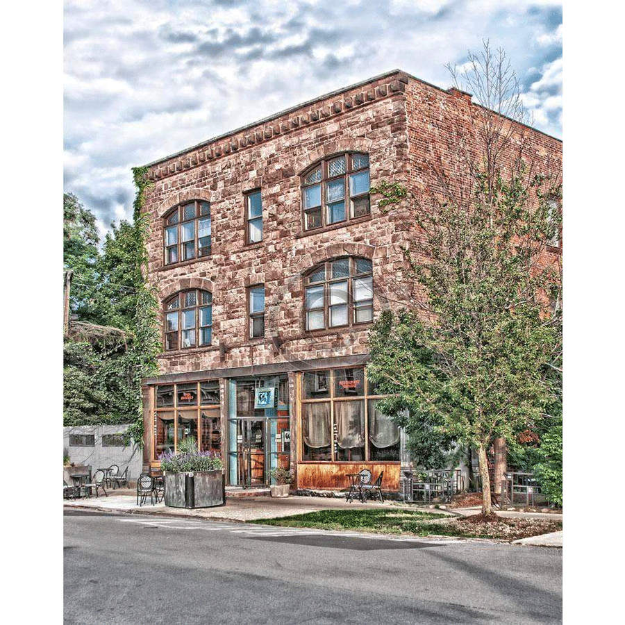 Left Bank Restaurant Magnet - Acrylic Fridge Decor featuring a historic Buffalo NY building with rustic brick facade and outdoor seating.
