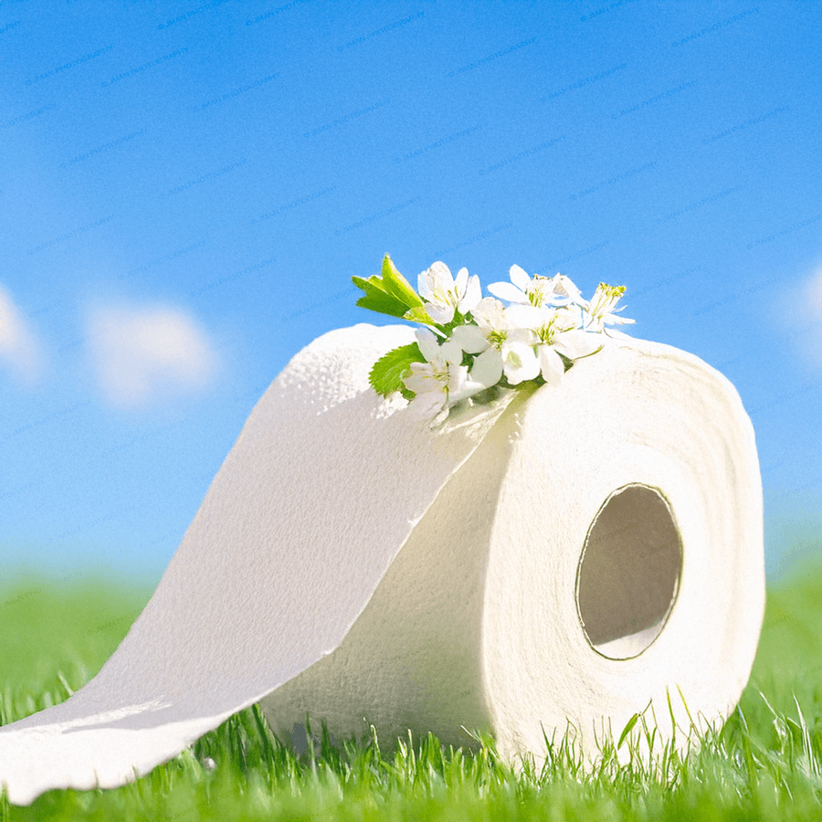 Close-up of White Flowers Art Toilet Paper print showing a white floral toilet paper roll on grass. Ideal for quirky bathroom wall decoration.