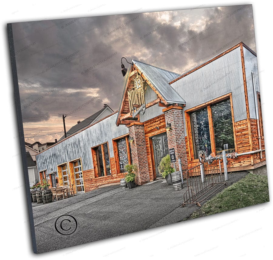 Angled view of 42 North Brewing Company - Craft Brewery East Aurora artwork highlighting architectural detail and vibrant textures of the brewery facade.