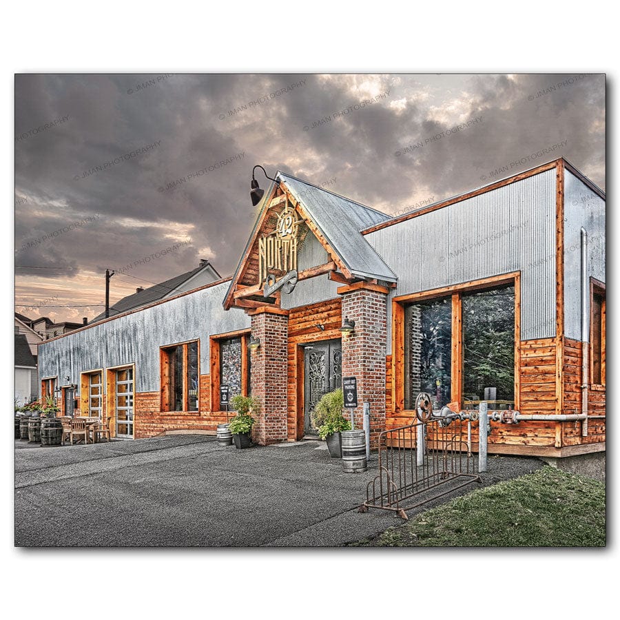 42 North Brewing Company - Craft Brewery East Aurora print features rustic industrial brewery exterior with wood and metal accents under dramatic skies.