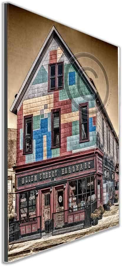 Framed wall art of Allen Street Hardware - Cafe Experience | Historic Allentown, showcasing Buffalo architecture in a vibrant, angled display.