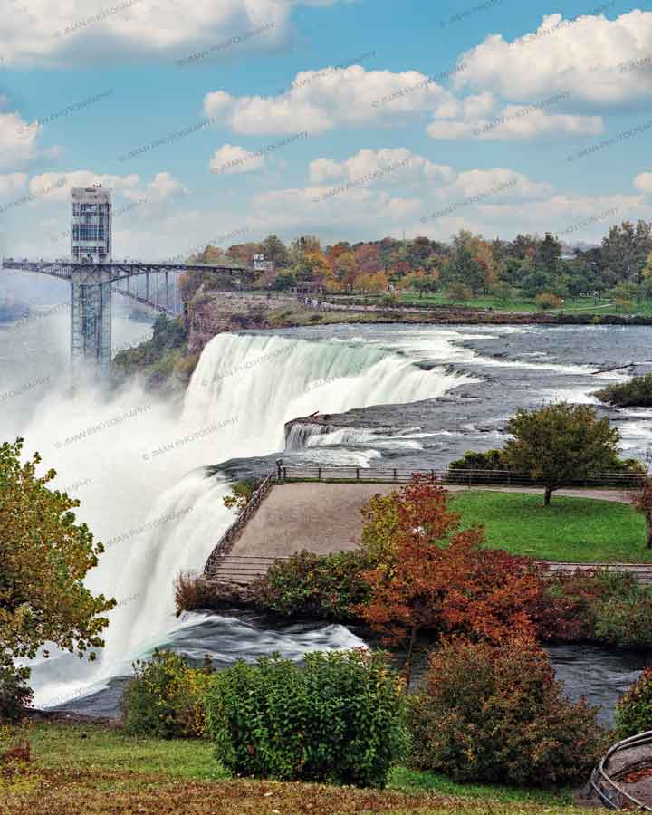 American Falls in Fall - Niagara Photography by Jman Artwork showcasing vibrant autumn foliage and cascading waterfalls in Buffalo-WNY.