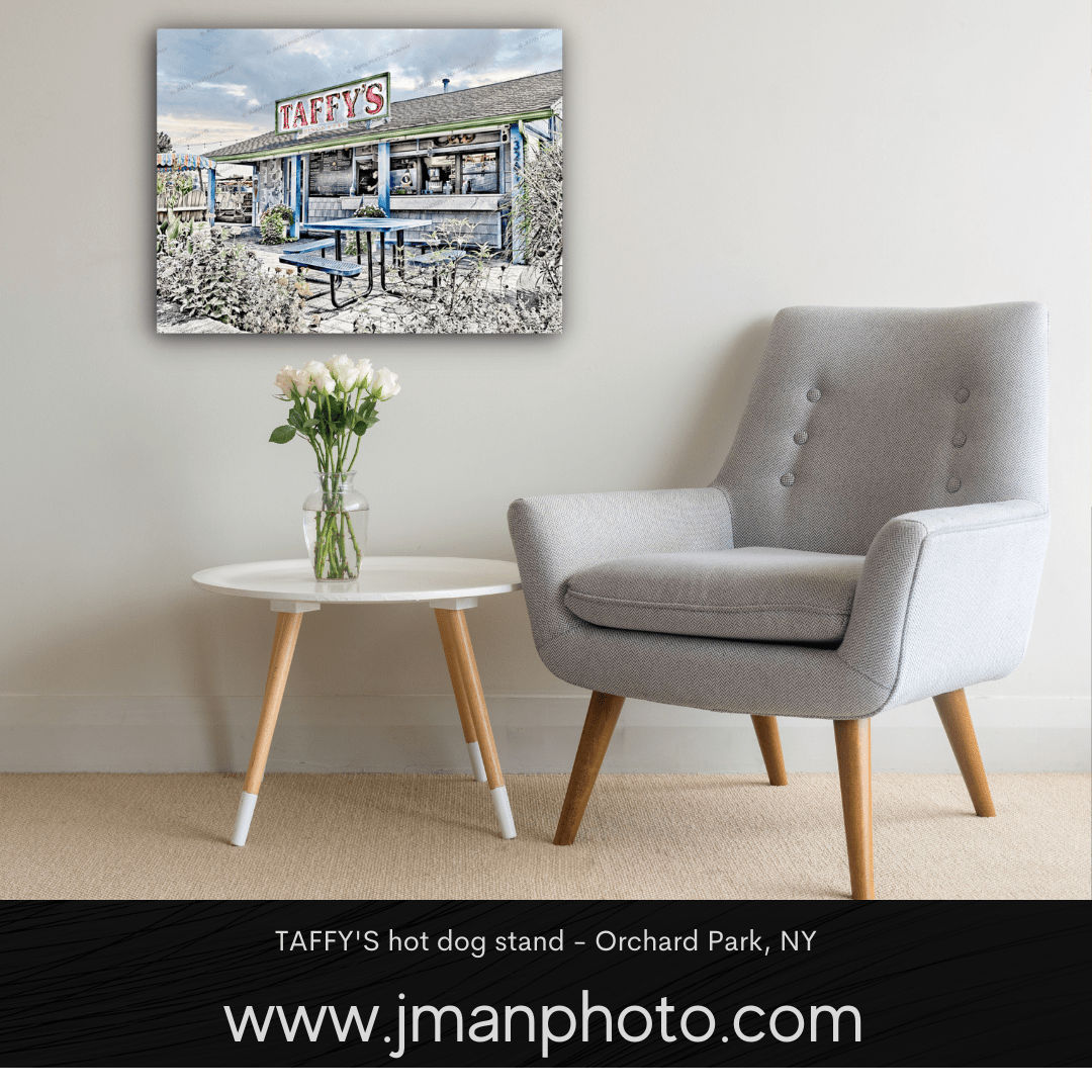 Framed wall art of Taffy's Hot Dog Stand displayed in a modern living room. Perfect Buffalo NY decor for home or office walls.