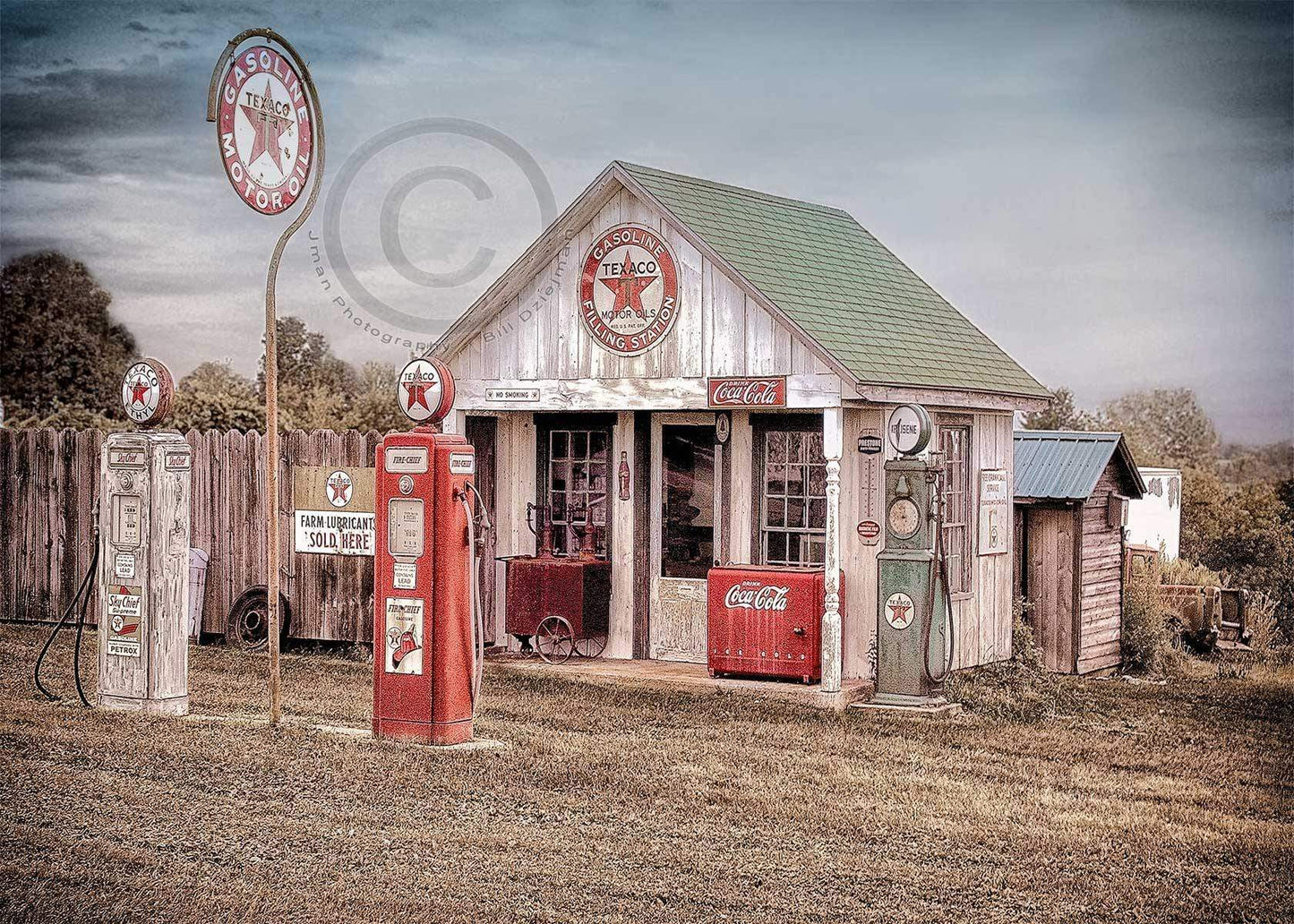 Vintage Texaco Gas Station Photo - Texaco #1 Print shows a rustic gas station with classic pumps and Coca-Cola signage, ideal for automotive decor.