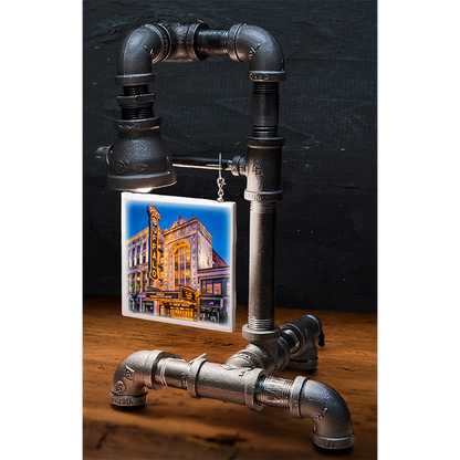Custom pipe lamp with black industrial piping and a hanging tile image of Buffalo's historic theater, perfect for home decor
