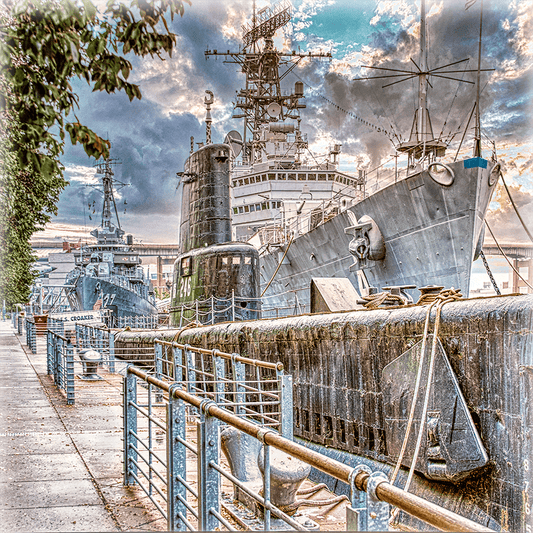 Buffalo Naval & Military Park ceramic coaster showcasing detailed photograph of docked submarines and battleships under dramatic skies.