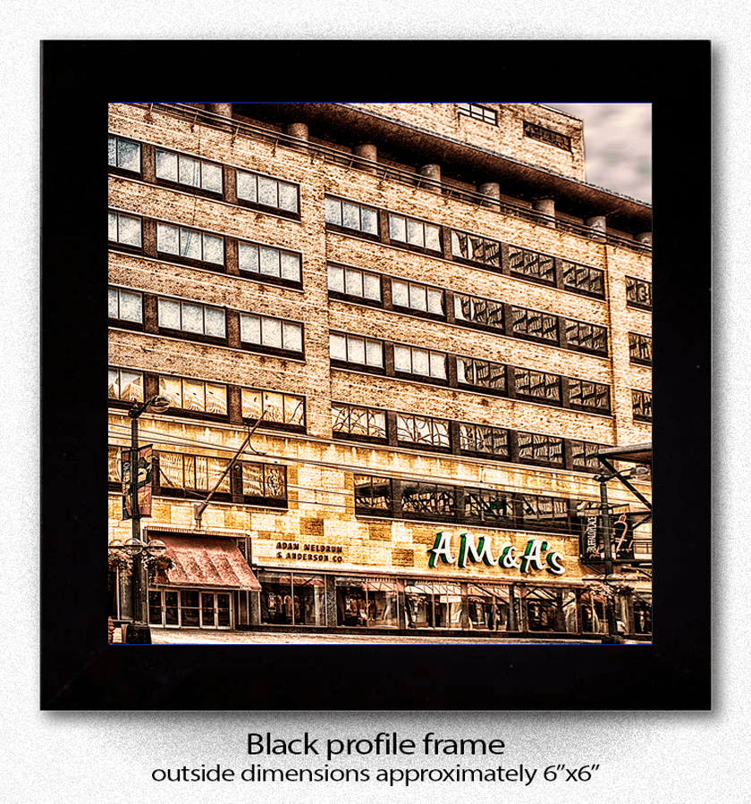 Framed Ceramic Coaster with A M & A's Buffalo landmark image, displayed in a black profile frame, ideal for home or office decor.