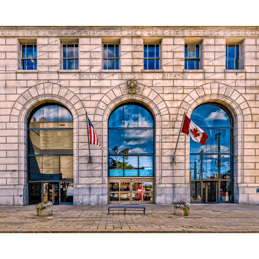 Admiral Room event space Buffalo in Marin Building with American and Canadian flags, historic architecture, and arched windows reflecting cityscape.