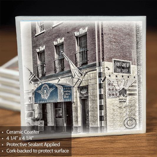 Founding Fathers Coaster - Ceramic Home Decor featuring a historic Buffalo pub with patriotic flags and signage. Durable, cork-backed for surface protection.