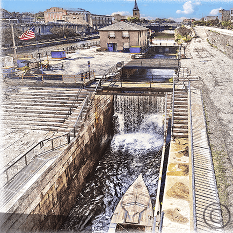 Lockport Locks canal with water flowing through, surrounded by buildings and flags.