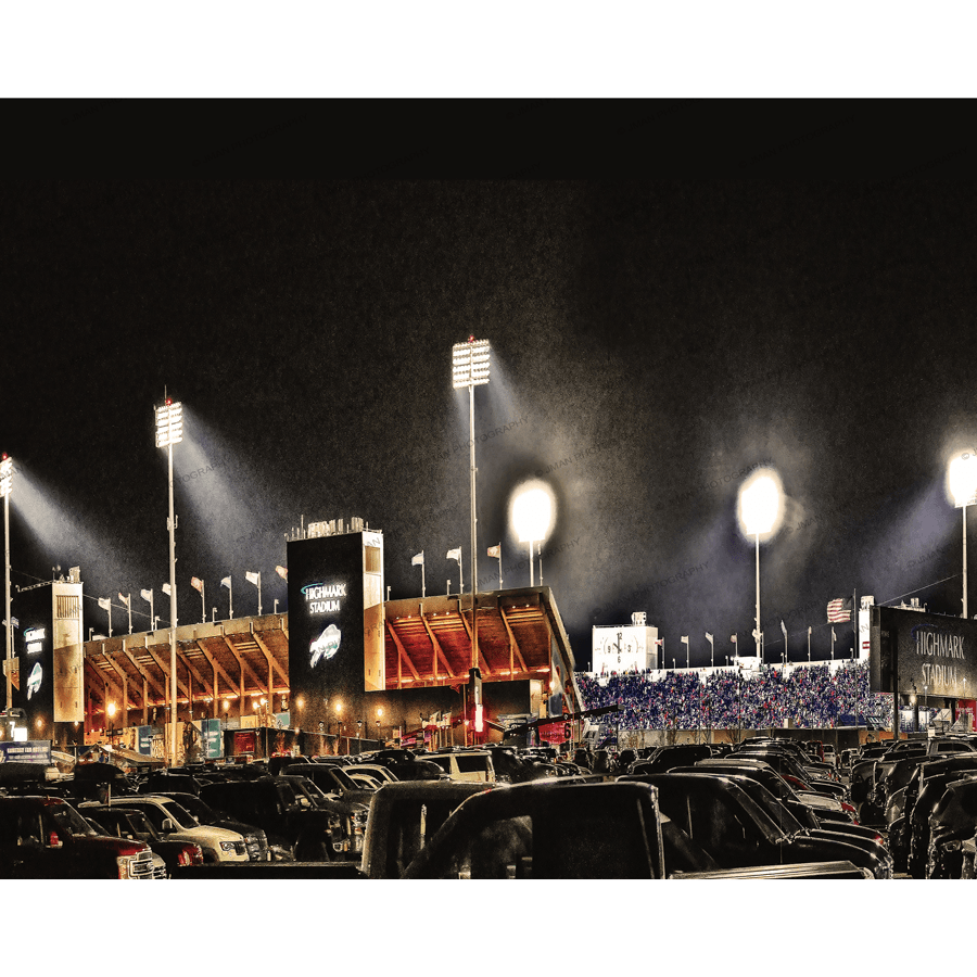 Highmark Stadium - Buffalo Bills - Official Home lit up at night with fans in stands and parking lot full of cars, showcasing iconic Buffalo landmark.