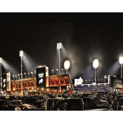Highmark Stadium - Buffalo Bills - Official Home lit up at night with fans in stands and parking lot full of cars, showcasing iconic Buffalo landmark.
