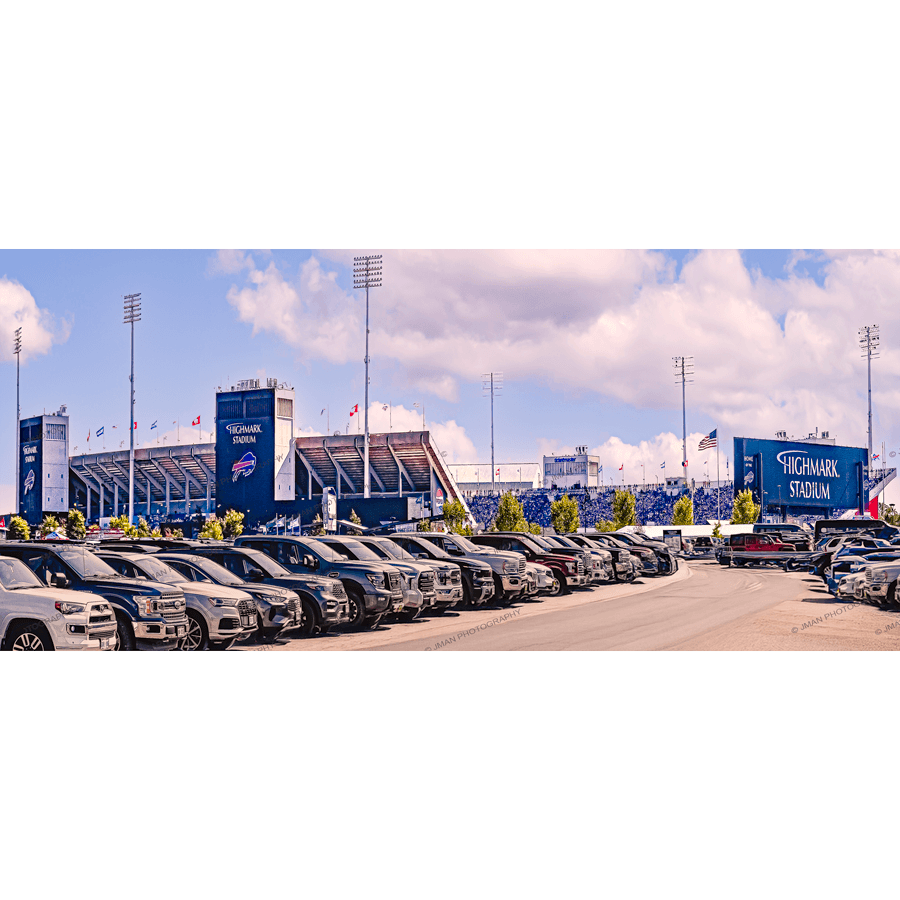 Buffalo Bills Stadium Print - Highmark Art shows a panoramic daytime view of Highmark Stadium with parked cars and blue skies. Ideal wall art for football fans.