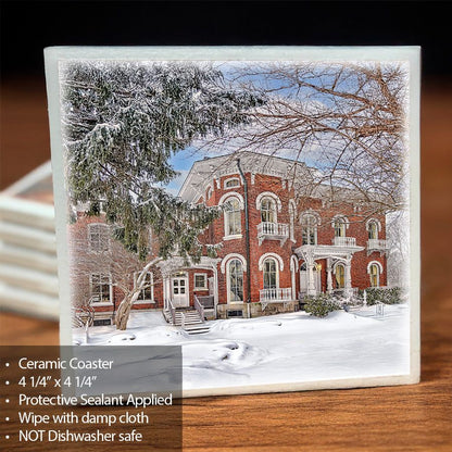 Kenan House Ceramic Coaster featuring a snowy winter scene of the historic mansion in Lockport, NY. Unique drinkware with protective sealant.