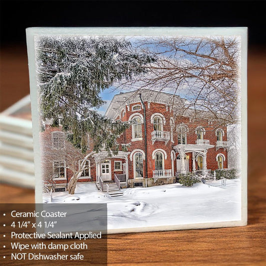 Kenan House Ceramic Coaster featuring a snowy winter scene of the historic mansion in Lockport, NY. Unique drinkware with protective sealant.