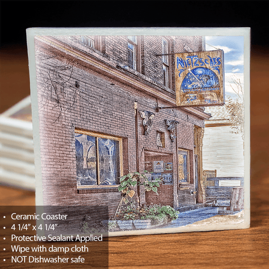 Nietzsche Ceramic Coaster featuring a photographic image of a historic Buffalo building with a cork backing, ideal for home decor and barware use.