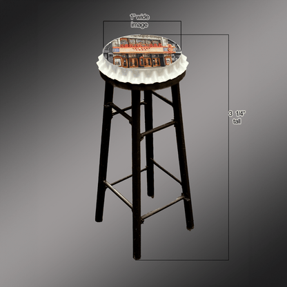 North Park Theatre bar stool with a bottle cap seat featuring a vivid image of the theater, combining fun seating with a durable, unique design.