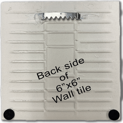 Back side of Ceramic Tile Wall Art Trivet - Angel Food Cake with metal hanger and rubber feet. Durable 6'x6' kitchen wall tile for home decor.