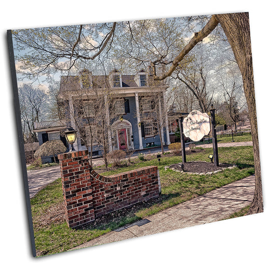 Mounted print of One-Eyed Cat Brewery in Williamsville, NY, showcasing its historic architecture and landscaped surroundings.