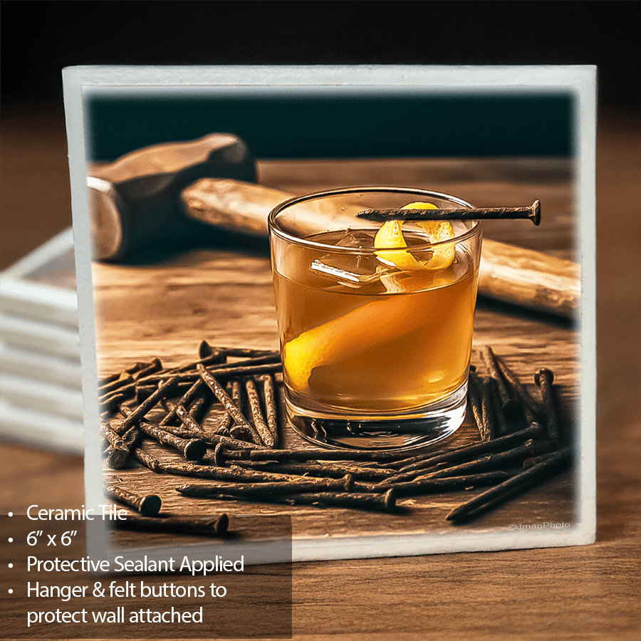 Rusty Nail Cocktail on ceramic tile with lemon twist garnish, surrounded by nails and hammer; bar wall art and trivet for home decor.