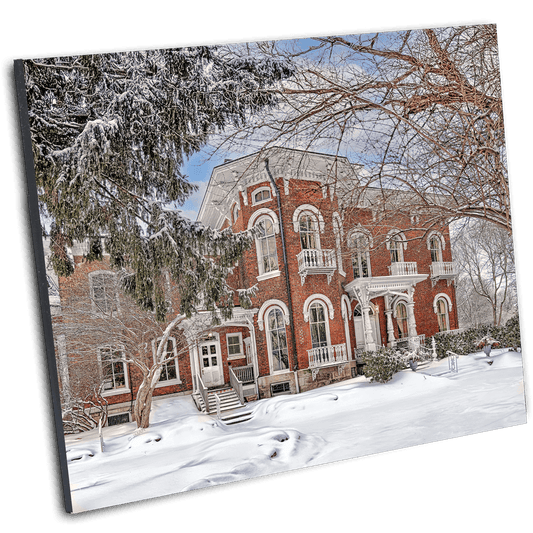 Kenan Center House Photo Print - Lockport NY Winter by Jman shows a red-brick Victorian mansion covered in snow, ideal for historical home decor.