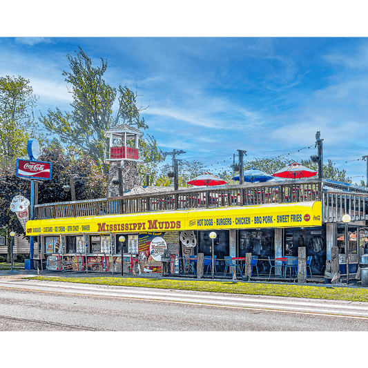 Tonawanda photo of Mississippi Mudds restaurant with bright yellow signage and rooftop seating, capturing nostalgic Buffalo landmark charm.